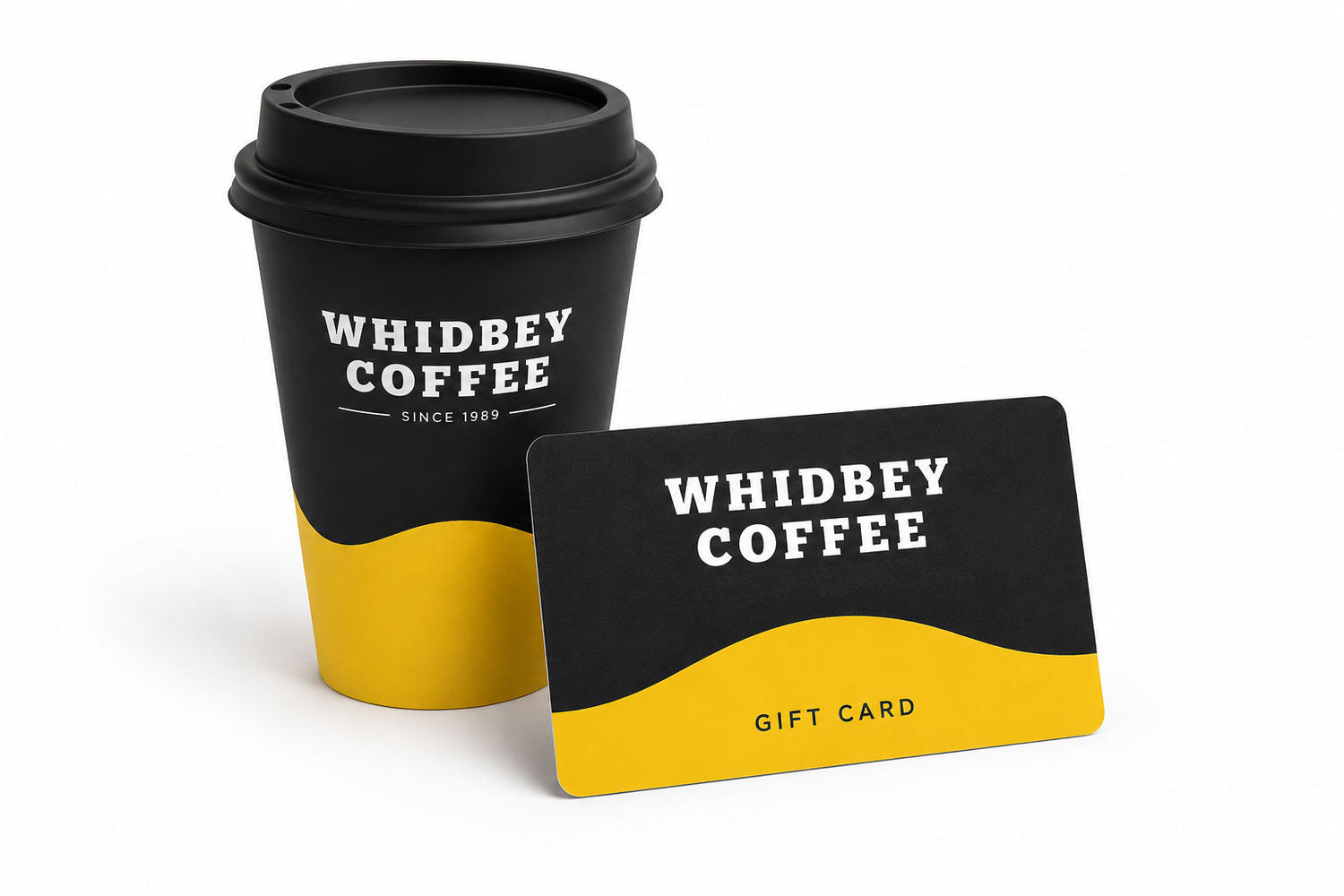 gift card leaning against togo coffee cup on white surface